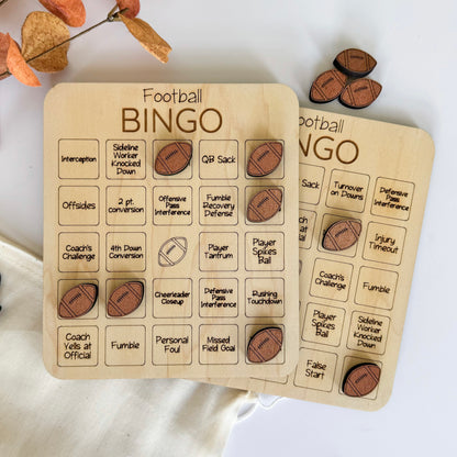 a pair of wooden game pieces sitting on top of a table