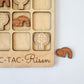 a wooden puzzle with a wooden elephant and other wooden animals