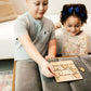 a couple of kids that are playing with a table