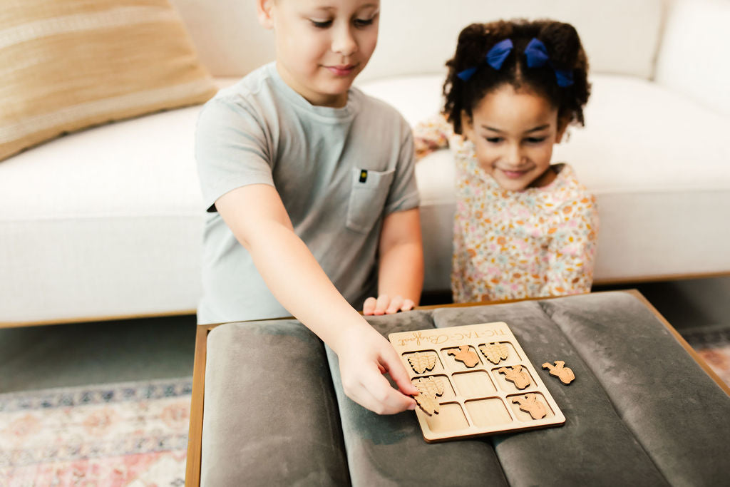 a couple of kids that are playing with a table