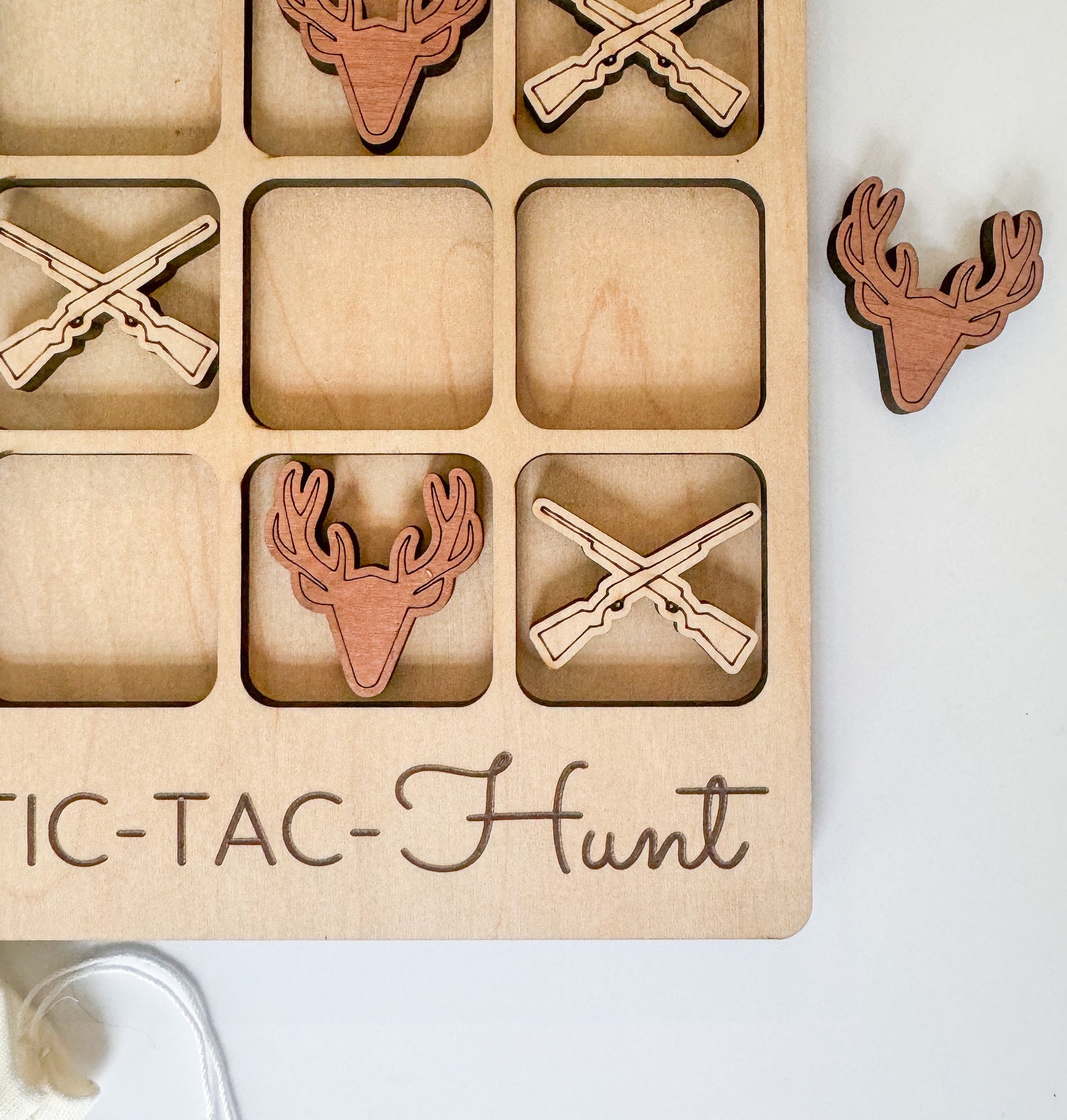 a wooden box with wooden cutouts of deer and antlers