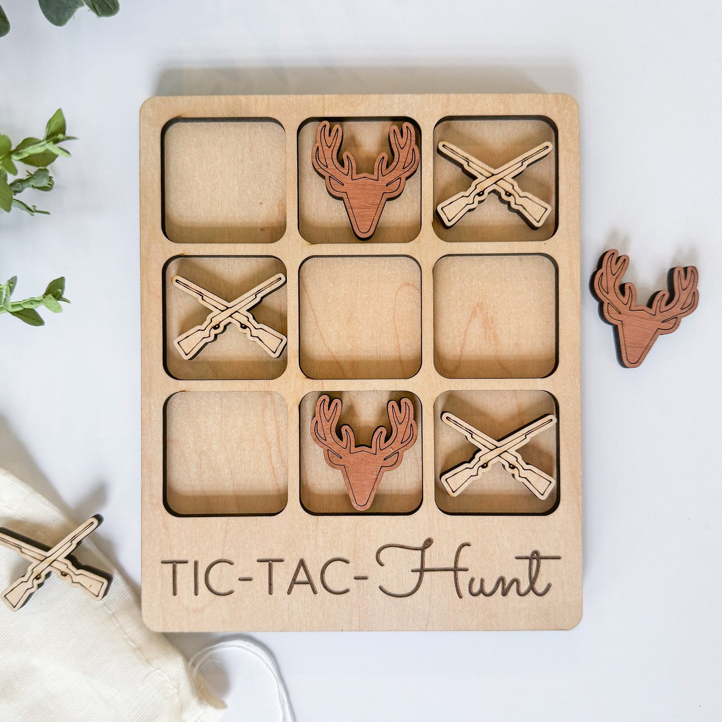 a wooden tic - tac - hunt game with deer heads and antlers