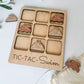 a wooden tic - tac - swim game with pieces of wood cut out