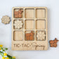 a wooden tic - tac - spring board with flowers and a teddy bear