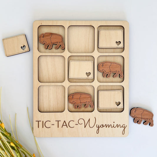 a wooden puzzle with elephants and hearts on it