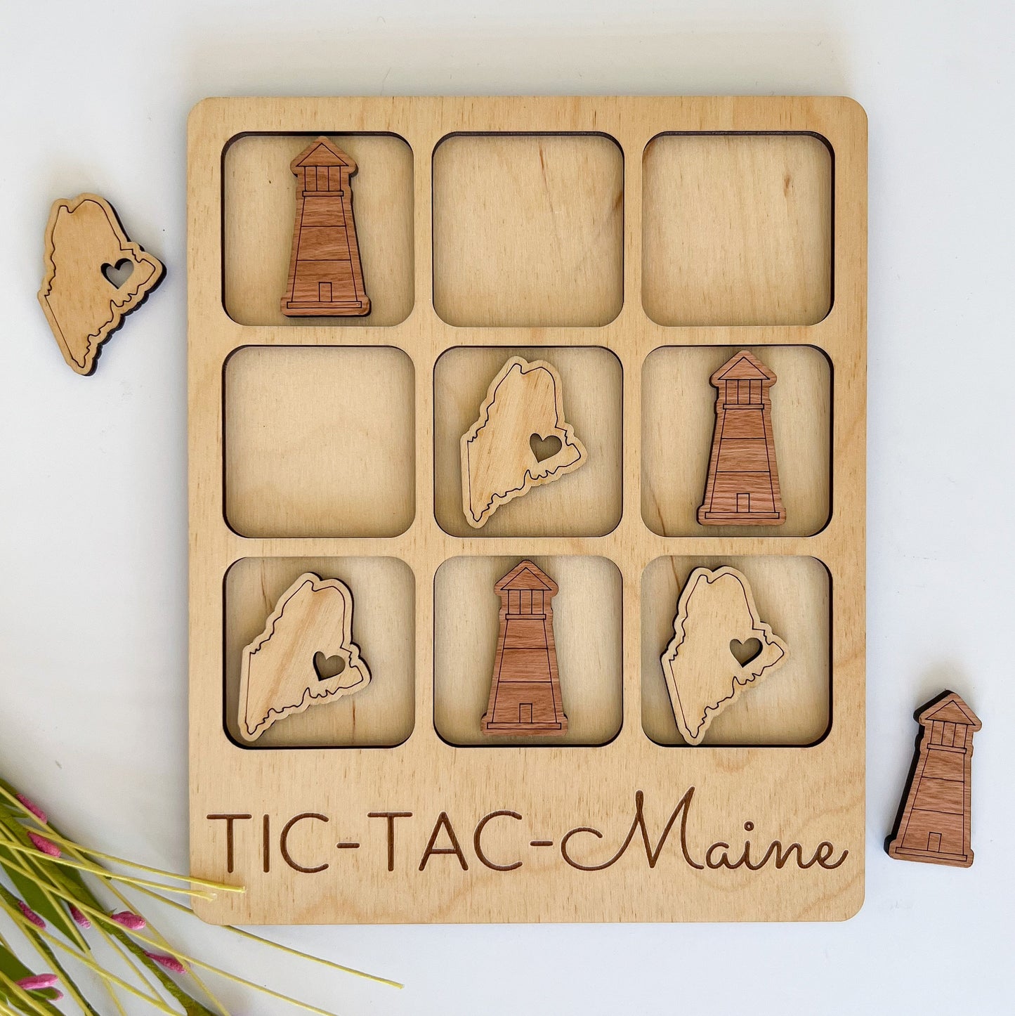 a wooden puzzle with a picture of the state of maine