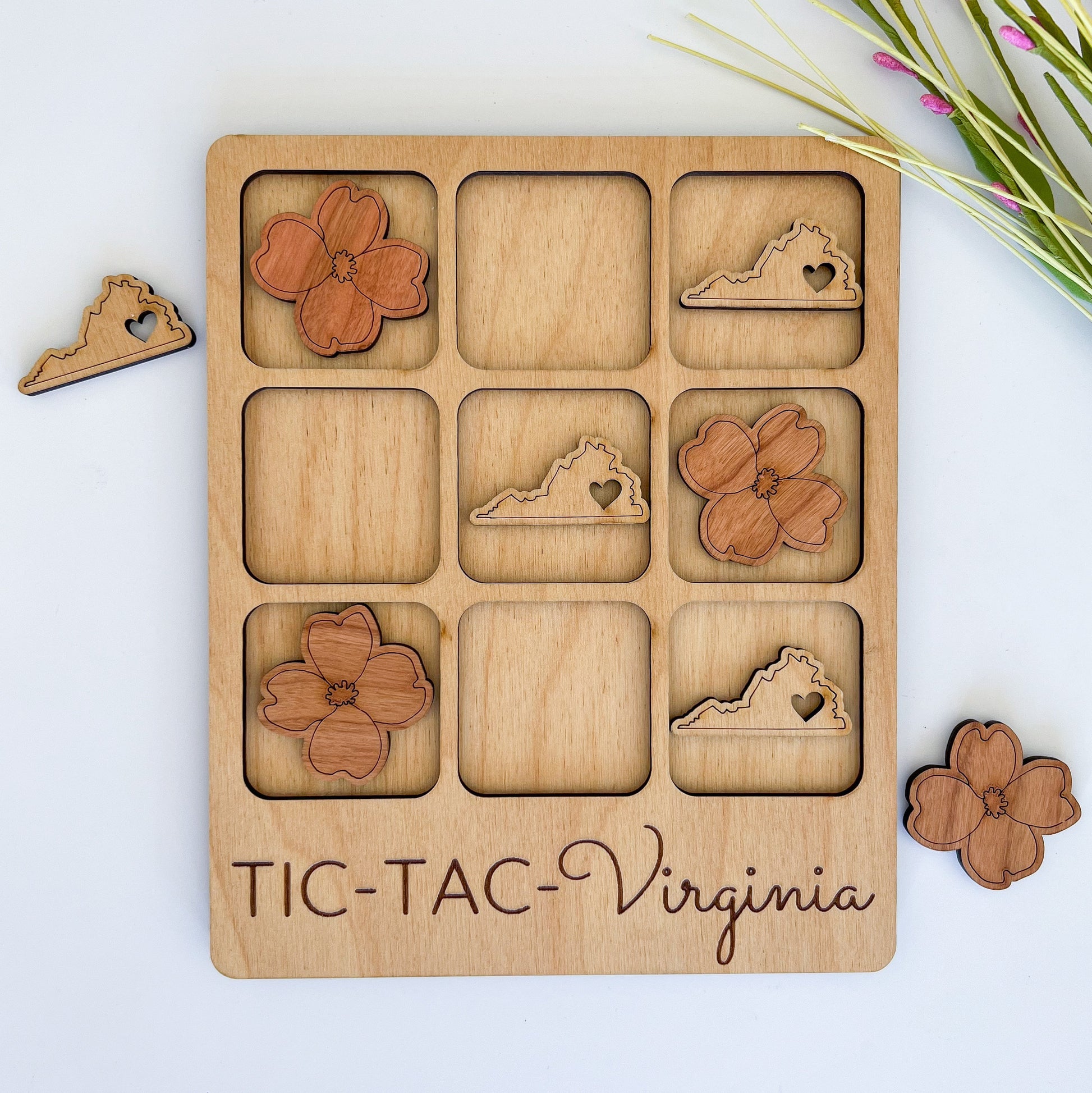 a wooden puzzle with a picture of shoes and flowers