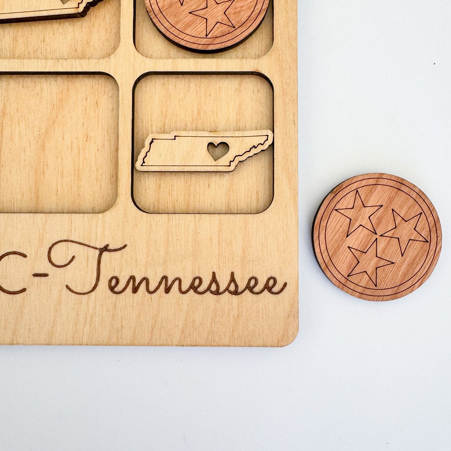 a wooden cutout of a state with the name tennessee