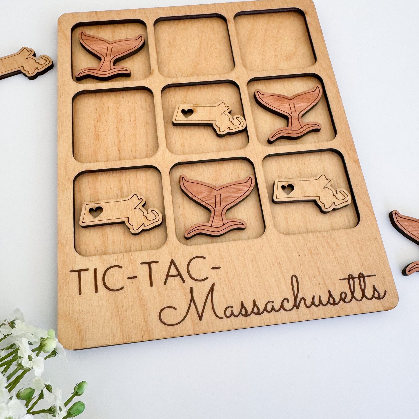 a close up of a wooden tray with magnets on it