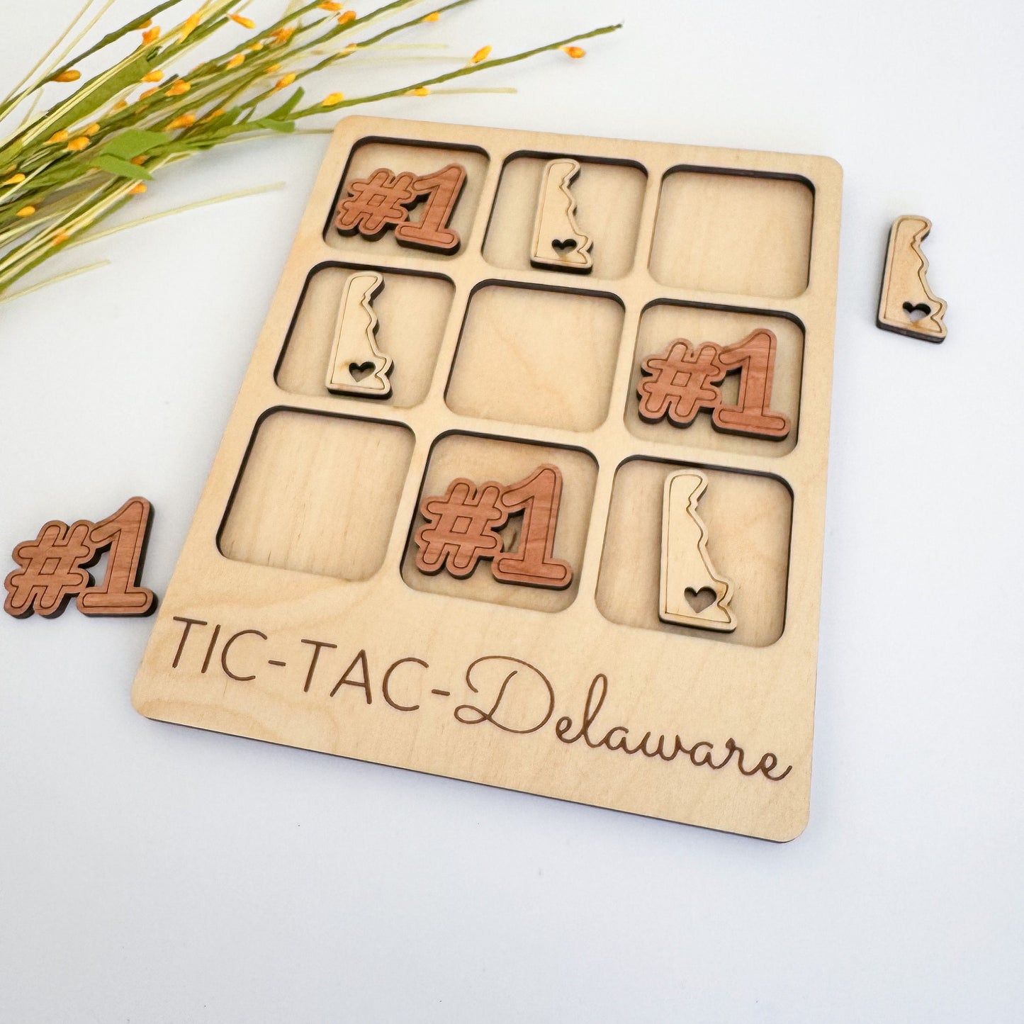 a wooden puzzle with the words ticta delaware on it