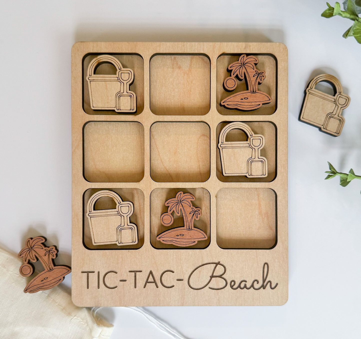 a wooden tic - tac - beach set with a palm tree, a