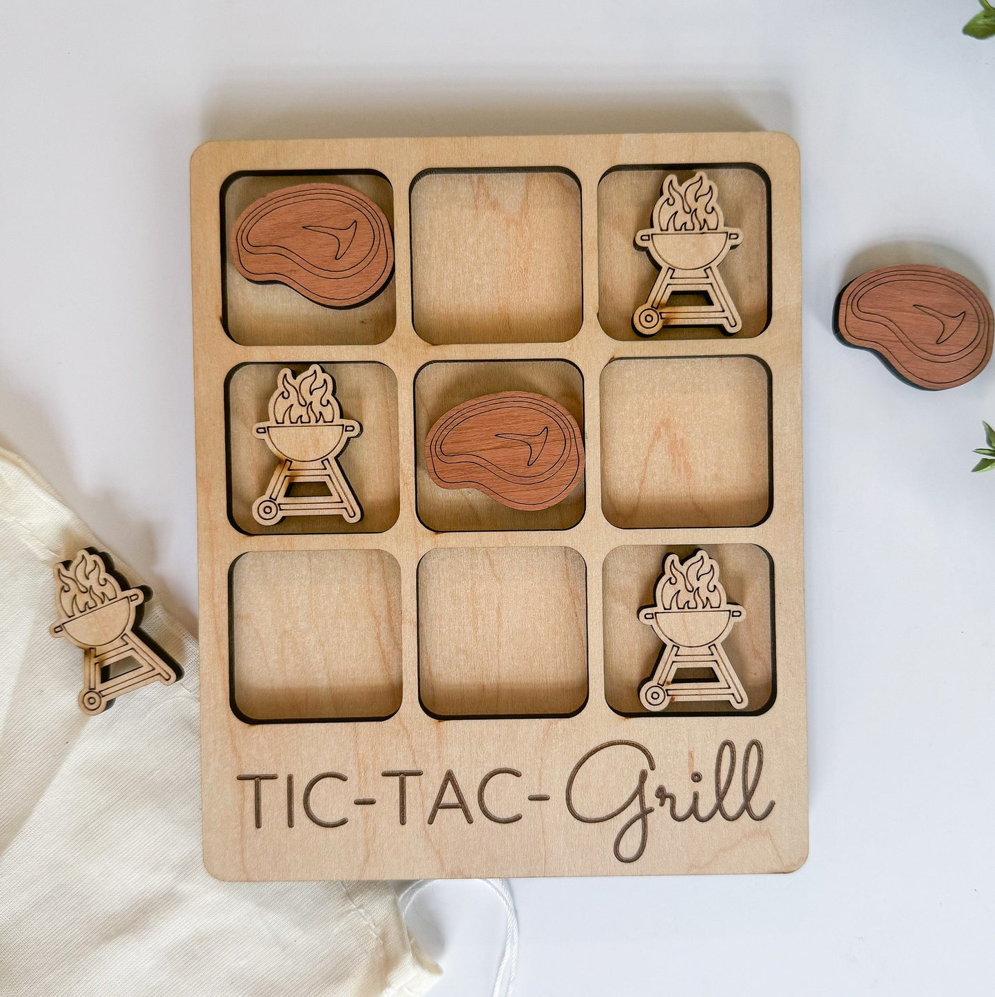 a wooden tic tac - tac - grille game set on a white