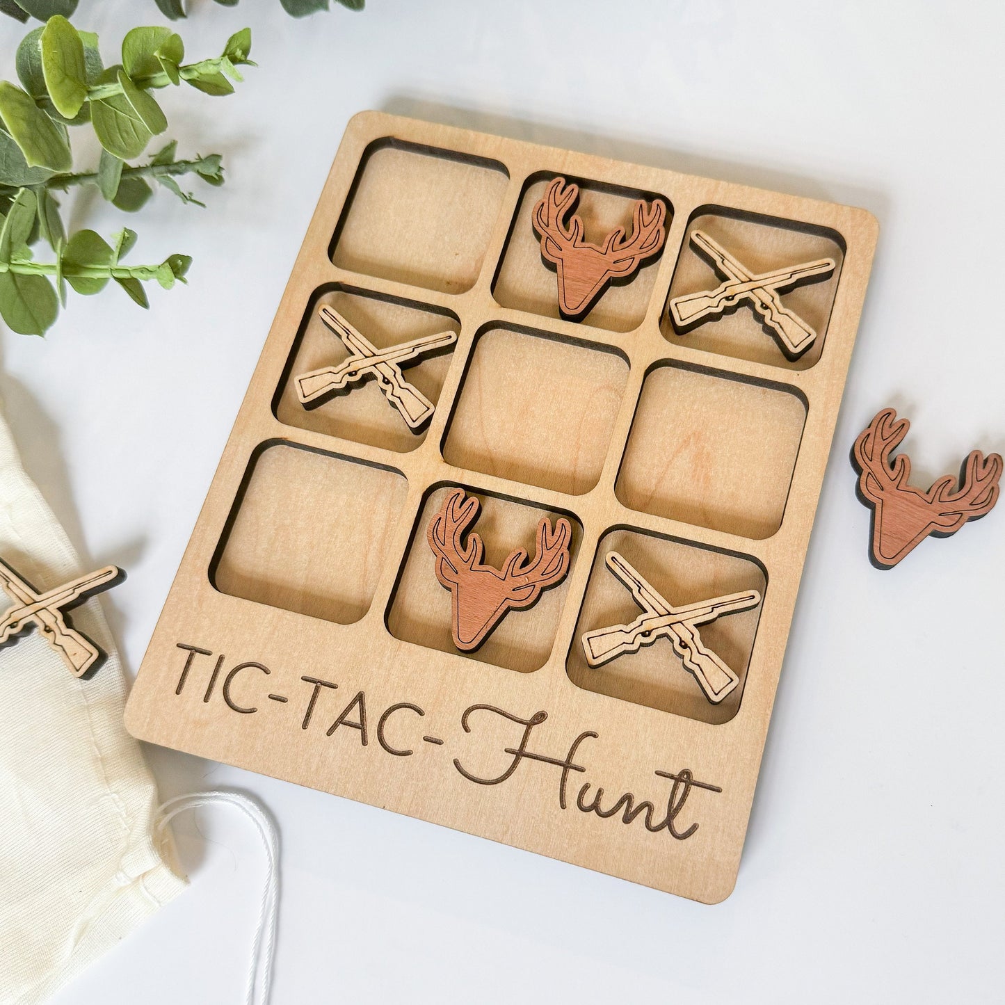 a wooden tic - tac - hunt game with deer heads and antlers