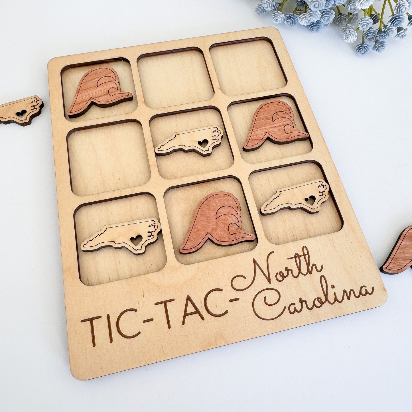 a picture of a wooden tic tac - tac - carolina board with