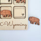 a wooden puzzle with elephants and a heart