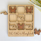 a picture of a wooden puzzle with animals on it