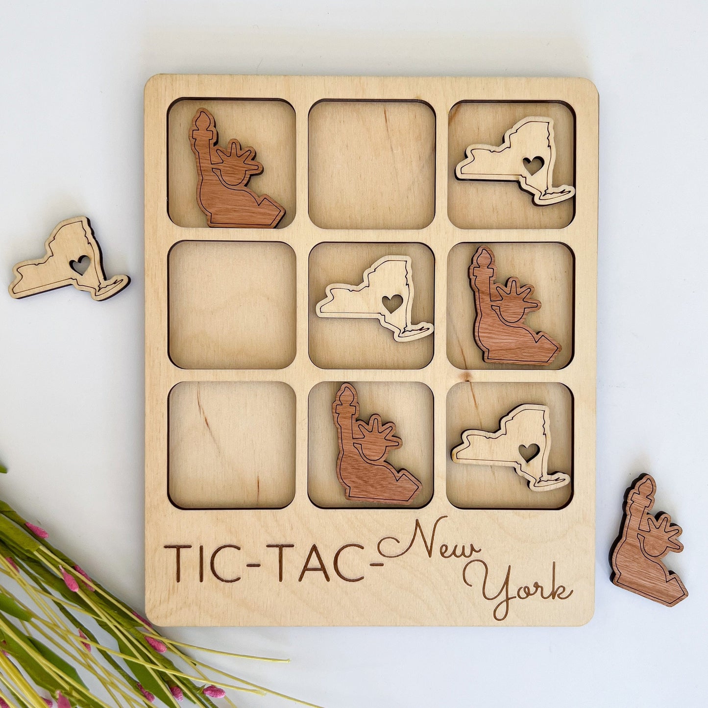 a wooden puzzle with a picture of a cat and a dog