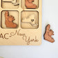 a wooden puzzle with a picture of a man and a woman