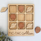 a wooden tic - tac - allon game with wooden pieces surrounding it