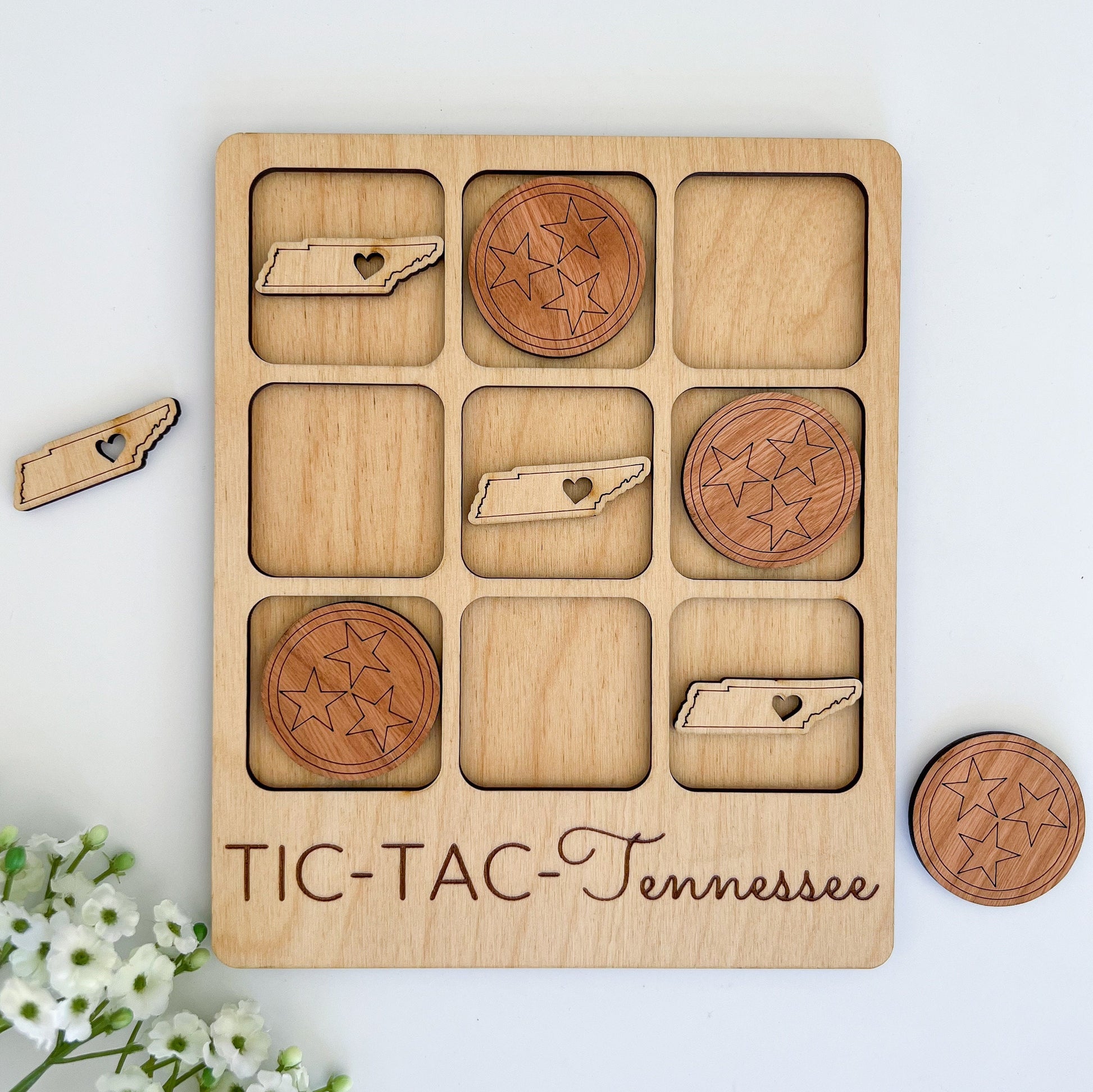 a wooden tic - tac - tennessee board game with pieces of wood and