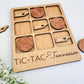 a wooden tic - tac - tennessee board with a couple of pieces of