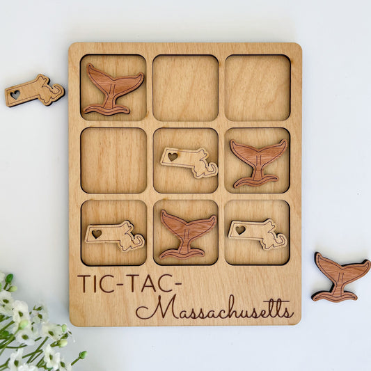 a wooden puzzle with a picture of a whale and other animals