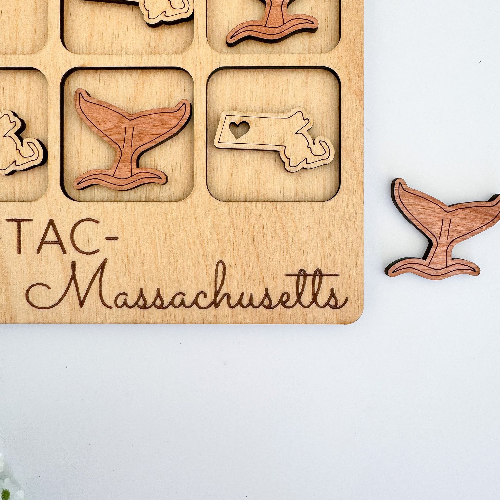 a wooden puzzle with a picture of massachusetts