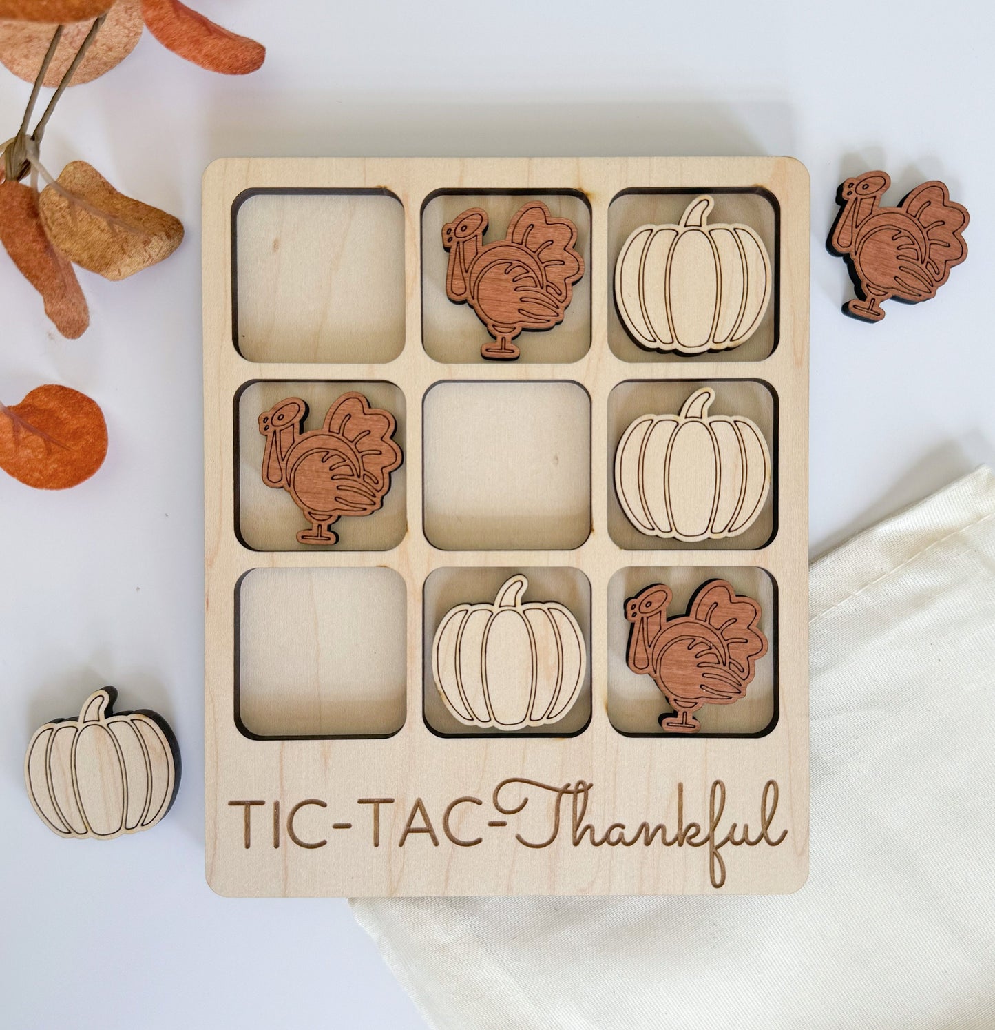 a wooden thanksgiving puzzle with turkeys and pumpkins