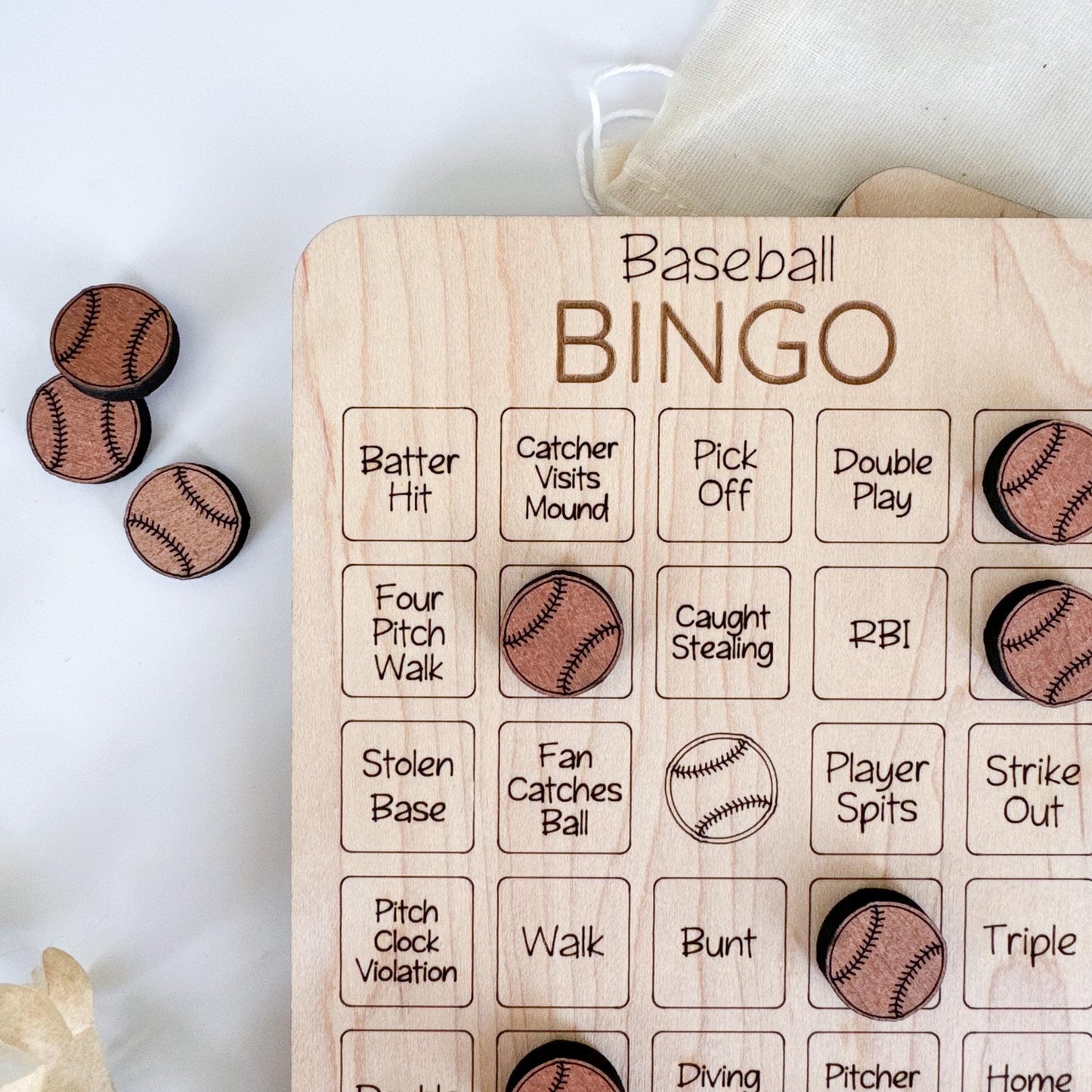 a baseball themed wooden game board with buttons