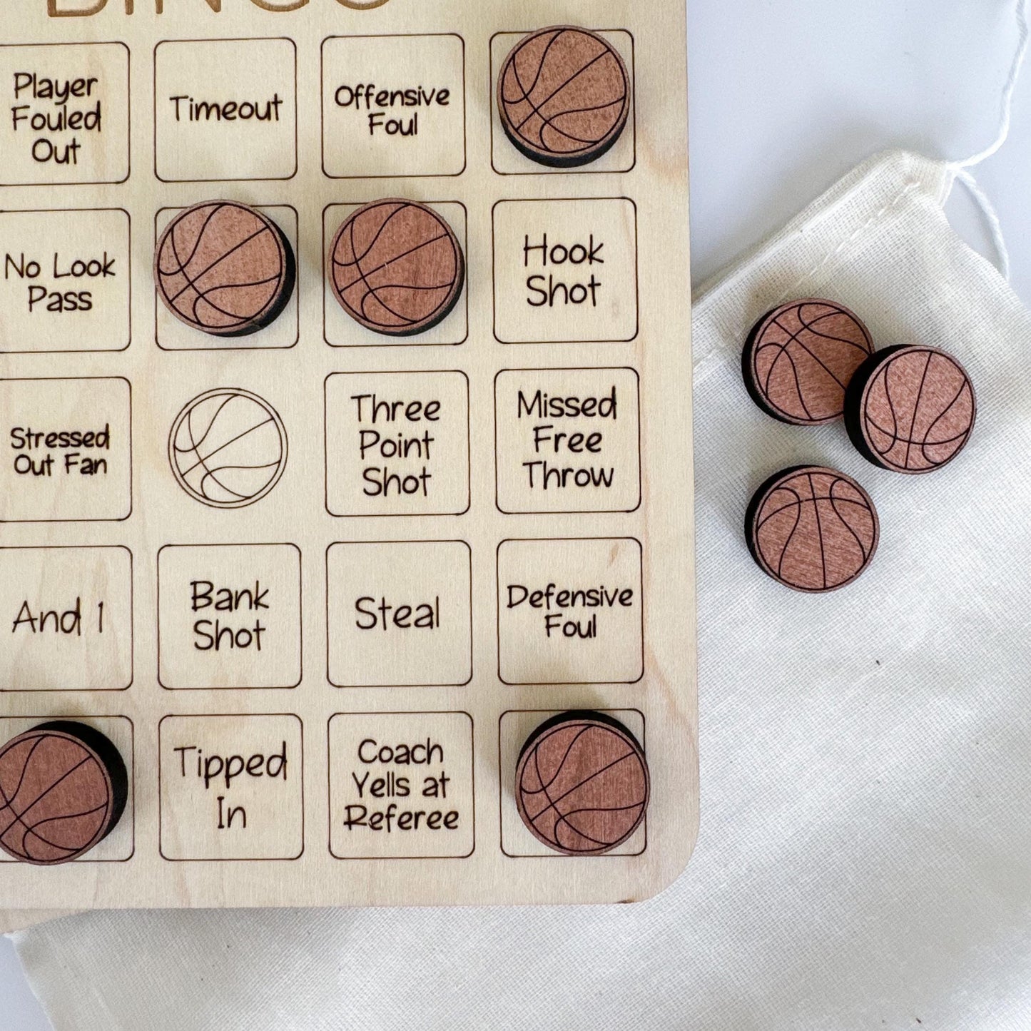 a wooden board with basketballs and words on it