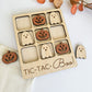 a wooden tic - tac - boo game with carved pumpkins and ghost