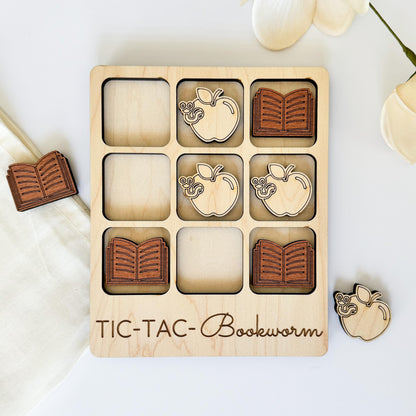 a wooden tic tac - tac - toe board with four pieces of